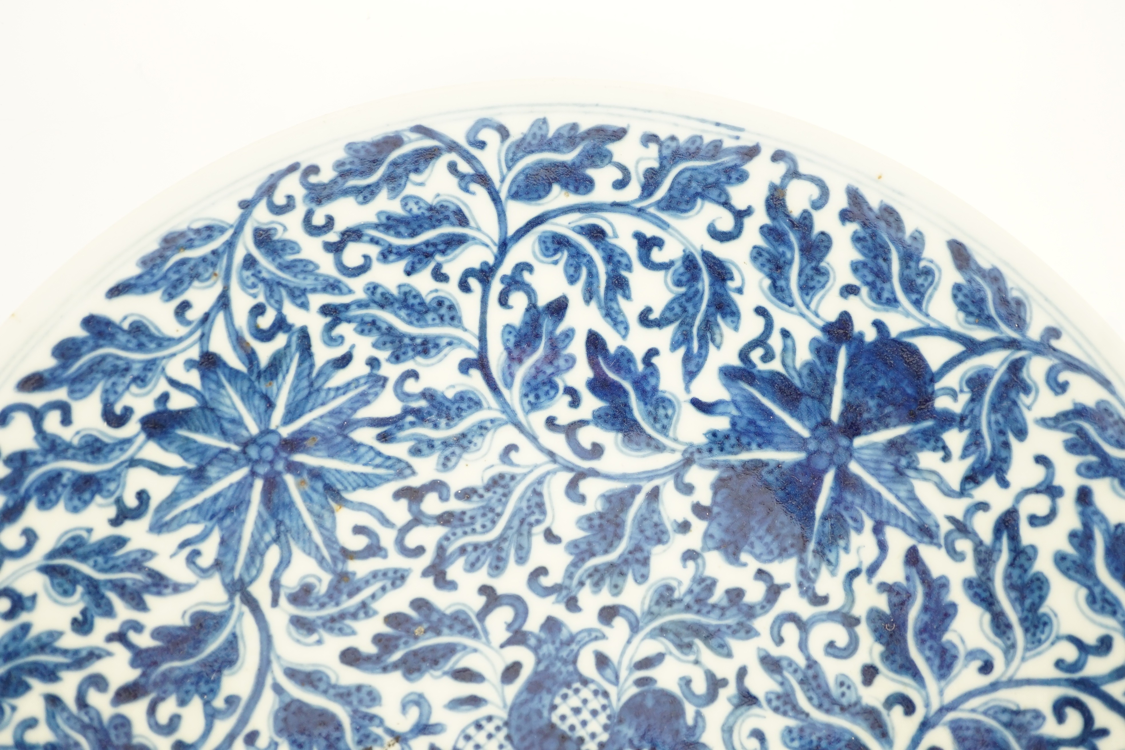 A Chinese blue and white dish, Kangxi mark, 19th century, 34.5cm diameter